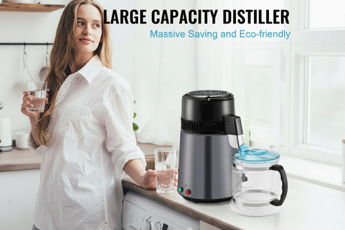 A woman in a white shirt stands in a bright kitchen holding a glass of water next to a dark gray large capacity water distiller machine and a clear glass carafe with a blue lid. Text at the top reads 'LARGE CAPACITY DISTILLER' and 'Massive Saving and Eco-friendly'.