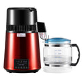 Red and black kitchen appliance with a clear measuring cup on a white background