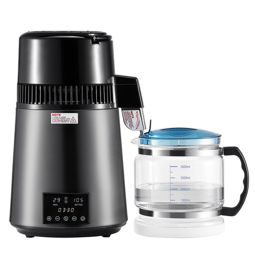 Black humidifier with digital display and a clear glass pitcher on a white background