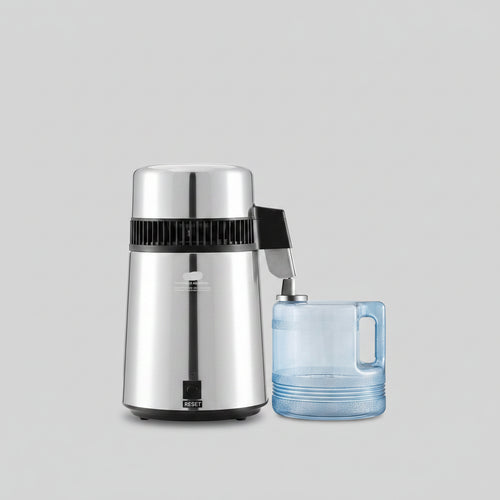 Black Vevor humidifier on a kitchen counter with a laptop and mug in the background