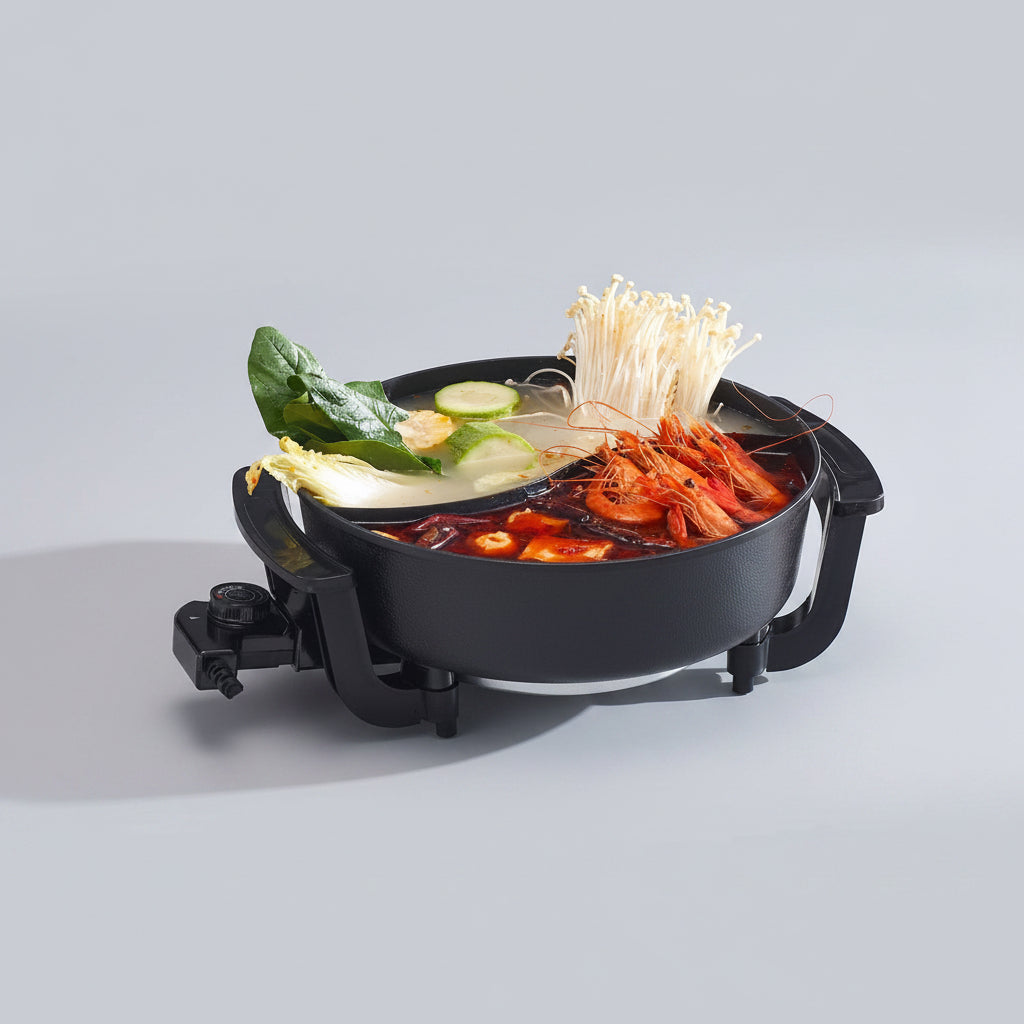Electric hot pot with ingredients on a table